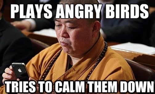 Monk playing Angry Birds