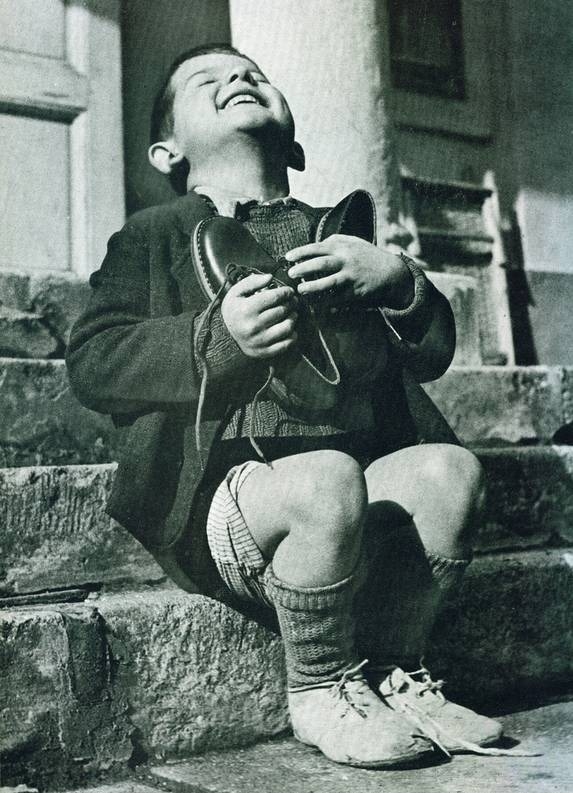 An orphan with new shoes