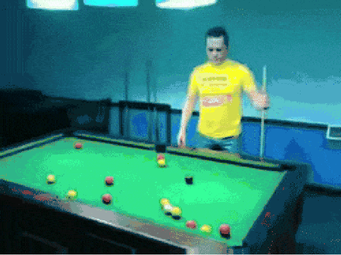 Drunk man plays pool