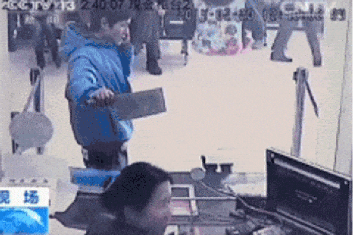 Teller laughing at robber
