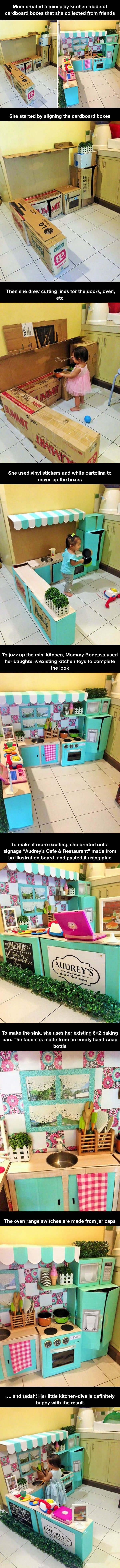 Mini play kitchen made of cardboard boxes