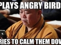 Monk playing Angry Birds