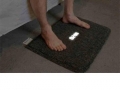 Carpet alarm clock