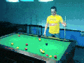Drunk man plays pool