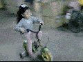 A cute toddler on a bike