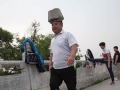 Chinese man has been walking with a 40kg rock on his head